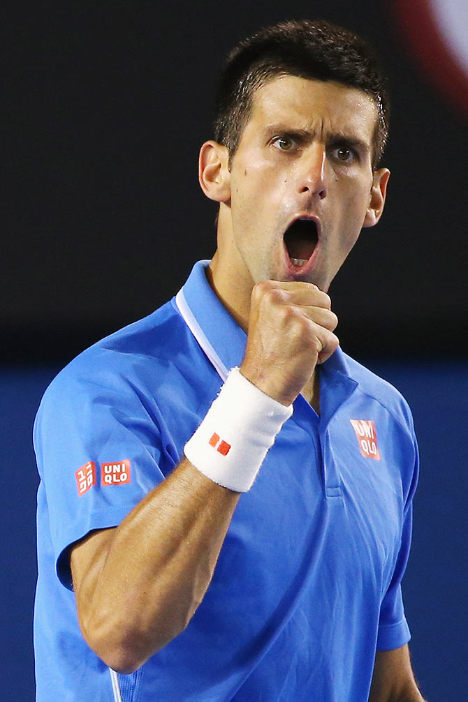 Novak Djokovic of Serbia celebrates winning a point in his quarter final match against Milos Raonic of Canada 