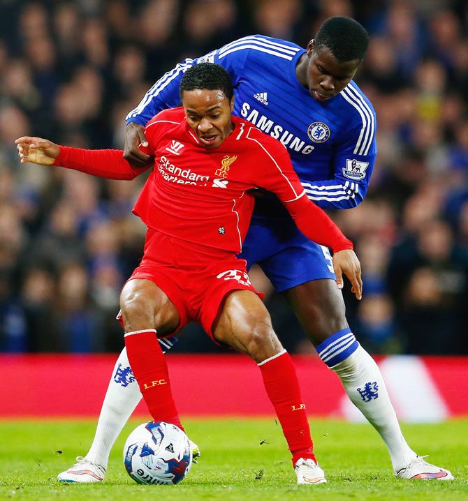 Raheem Sterling of Liverpool holds off Kurt Zouma of Chelsea 