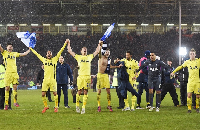 Spurs players celebrate after the Capital One Cup semifinal match