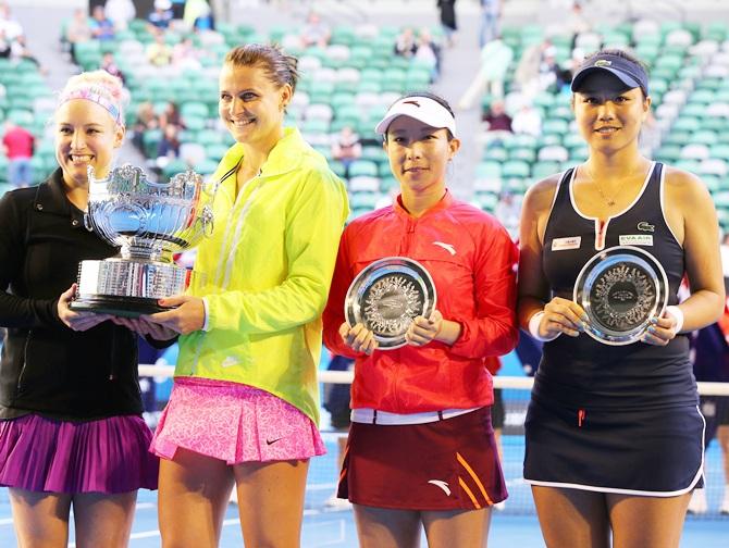 Bethanie Mattek-Sands of the United States and Lucie Safarova of the Czech Republic hold the trophy   after winning their final doubles match against Yung-Jan Chan of Chinese Taipei and Jie Zheng of China