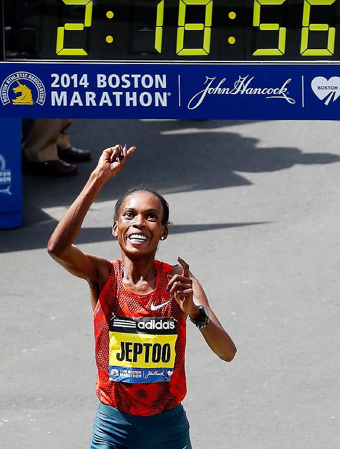 Rita Jeptoo of Kenya crosses the finish line to win the 118th Boston Marathon on April 21, 2014 in Boston, Massachusetts