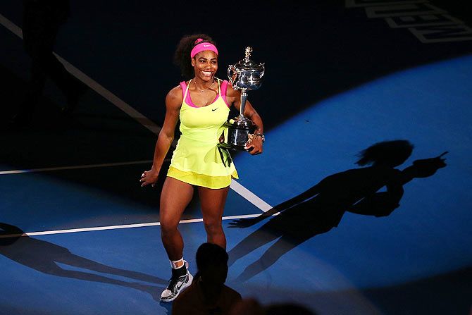 Serena Williams of the United States does a lap of honour as she holds the Daphne Akhurst Memorial Cup after winning Australian Open women's final against Maria Sharapova on Saturday