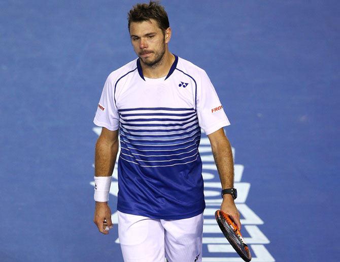 Stanislas Wawrinka of Switzerland reacts to a point in his semi-final against Novak Djokovic of Serbia at the Australian Open