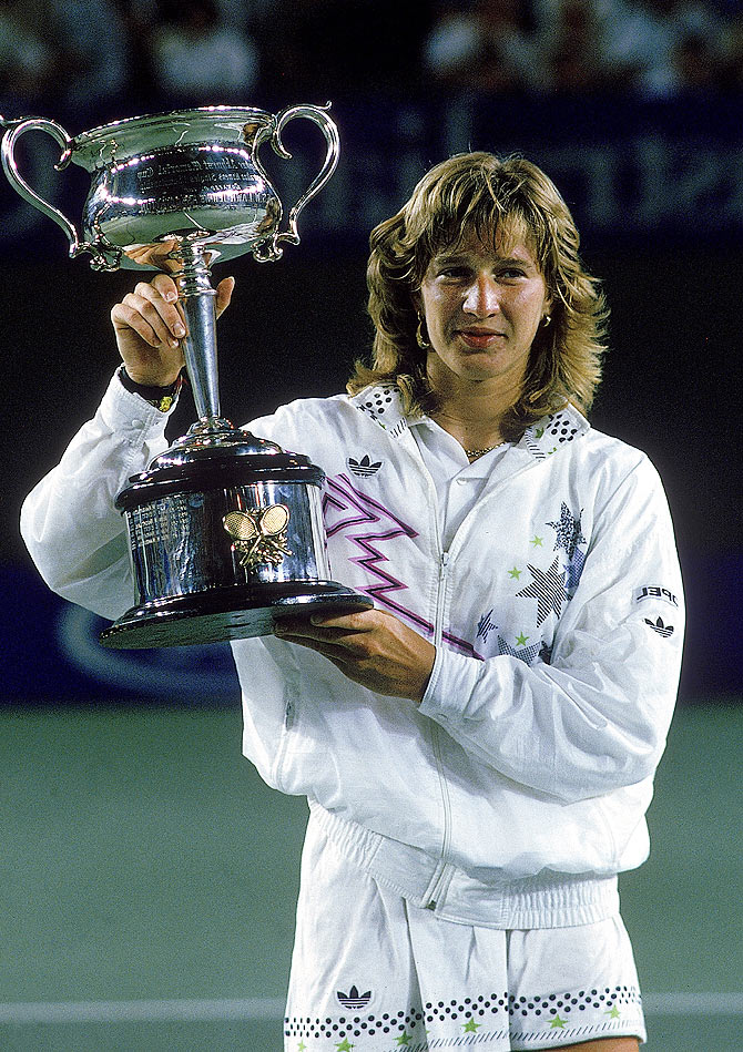 Steffi Graf of Germany raises the trophy after winning the Australian Open at Flinders Park 1988, in Melbourne