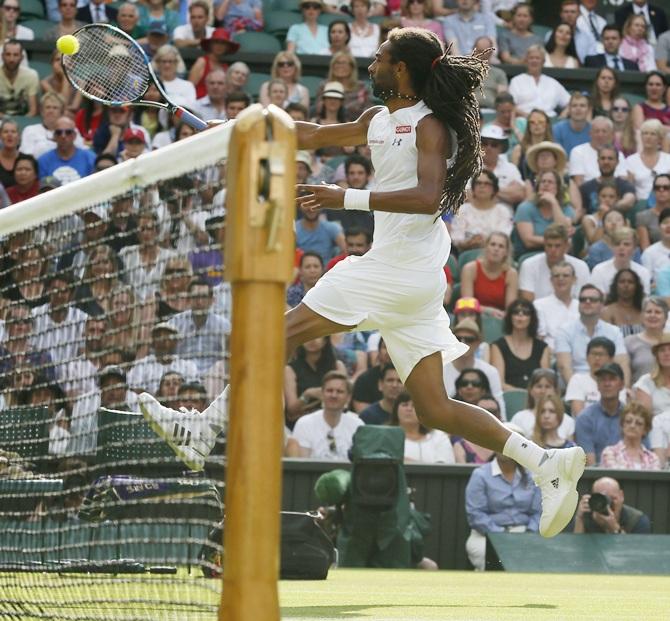 Dustin Brown of Germany hits a shot