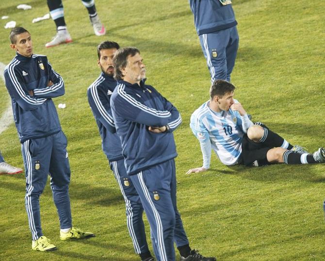 Argentina's Lionel Messi,right, and his teammates react 