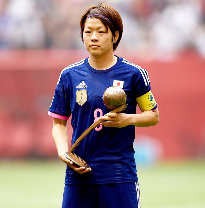 Japan's Aya Miyama poses after winning the Bronze Ball 