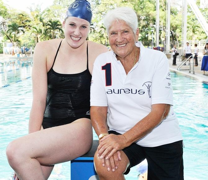 Swimmer Missy Franklin and Olympic great Dawn Fraser give a swimming lesson to local children 