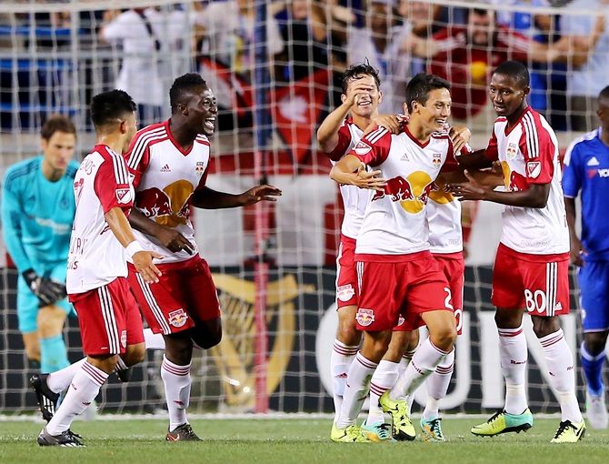 Sean Davis of New York Red Bulls is congratulated by teammates