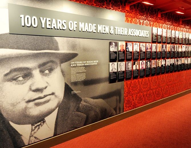 A wall of images of mobsters is displayed at The Mob Museum
