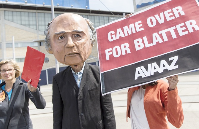 Activists with a mask of Joseph S. Blatter