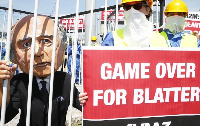 Activists from advocacy group Avaaz demonstrate near the Hallenstadion, where the 65th FIFA Congress will take place, in Zurich