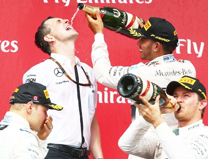Race winner Lewis Hamilton of Great Britain and Mercedes GP celebrates