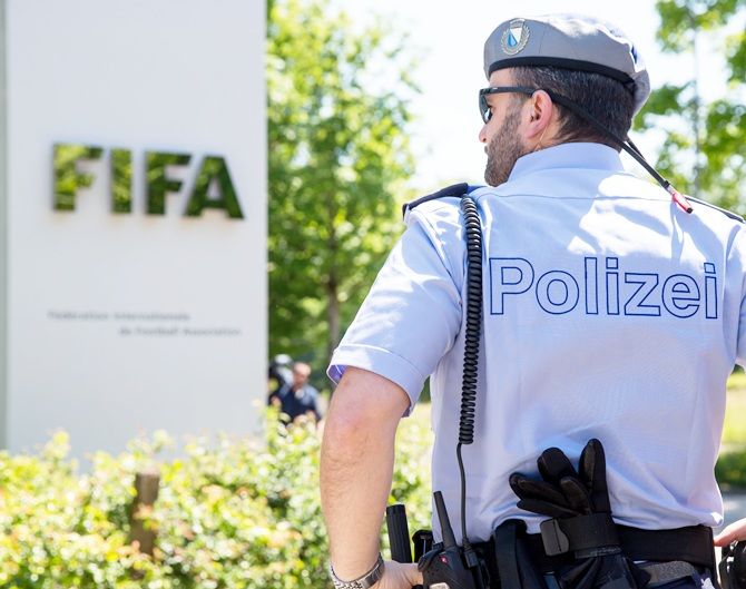 A policeman stands in front of the FIFA headquarters