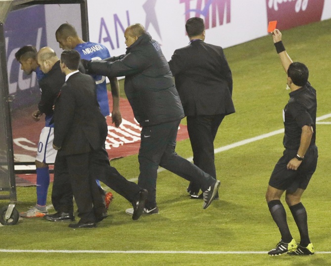 Brazil's Neymar, left, leaves the pitch as he receives a red card