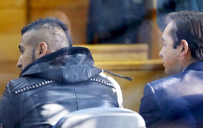 Chile's national team player Arturo Vidal, left, is seen inside a court at San Bernardo 