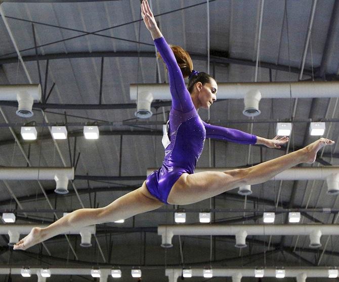 Malaysia's Farah Ann Abdul Hadi performs on the uneven bars during the women's artistic gymnastics team final at the Southeast Asian (SEA) Games in Singapore