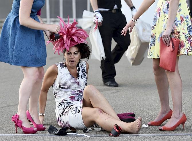 A racegoer makes light after a fall