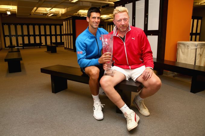Novak Djokovic of Serbia poses for a locker room photograph with his coach Boris Becker