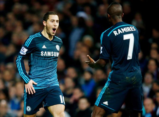 Eden Hazard of Chelsea celebrates with teammate Ramiresafter scoring the opening goal against West Ham during their Barclays Premier League match at the Boleyn Ground in London on Wednesday