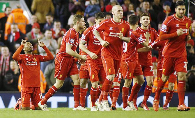 Liverpool's Daniel Sturridge (left) celebrates after scoring against Burnley