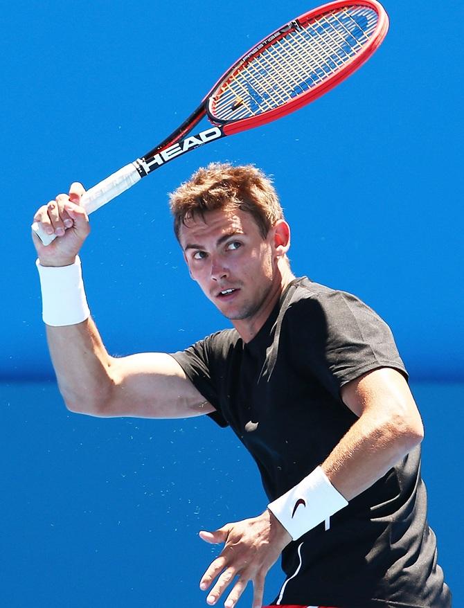 Henri Laaksonen of Switzerland plays a forehand