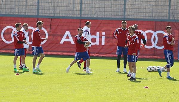 Bayern Munich players share a laugh during a training session on Monday