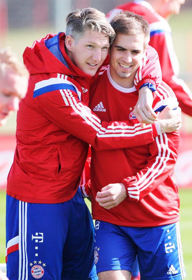 Bastian Schweinsteiger with Philipp Lahm at a training session on Monday