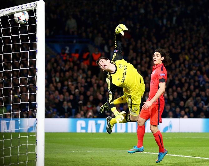 Goalkeeper Thibaut Courtois of Chelsea dives