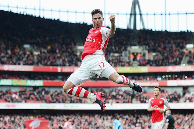 Olivier Giroud of Arsenal celebrates scoring the opening goal against West Ham United during the English Premier League match at Emirates Stadium on Saturday