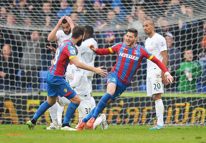 Joel Ward of Crystal Palace celebrates scoring his team's winning goal with teammate Joe Ledley during their English Premier League match against Queens Park Rangers at Selhurst Park in London on Saturday