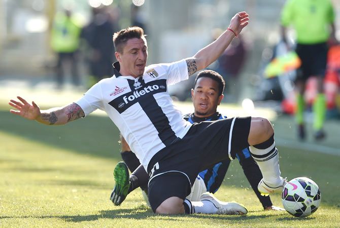 Cristian Rodriguez (left) of Parma FC is tackled by Urby Emanuelson of Atalanta BC during the Serie A match at Stadio Ennio Tardini on March 8, 2015