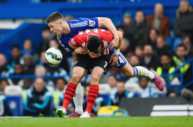 Chelsea's Gary Cahill runs into Southampton's Shane Long