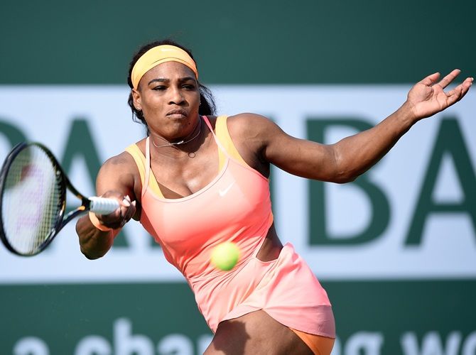 Serena Williams returns a forehand