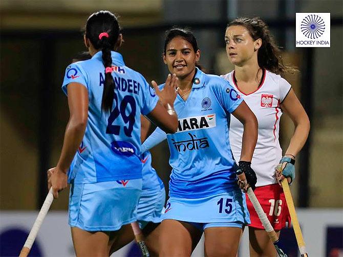 India players celebrate on scoring a goal against Poland on Sunday