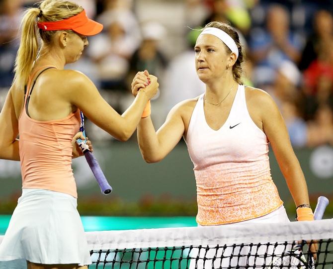 Maria Sharapova of Russia is congratulated by Victoria Azarenka of Belarus