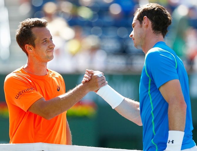 Andy Murray of Great Britain is congratulated by Philipp Kohlschreiber of Germany 