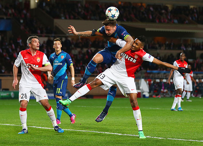 Arsenal's Olivier Giroud and Monaco's Wallace Fortuna dos Santos get into a tangle as they vie for possession