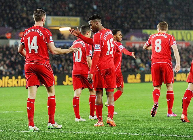 Liverpool players celebrate a goal