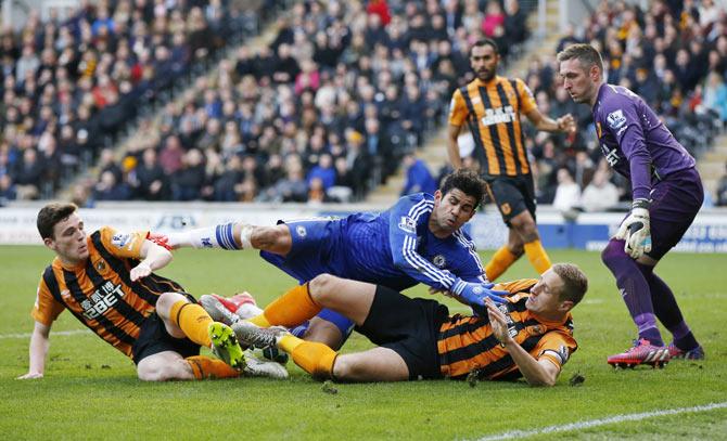 Chelsea's Diego Costa in action with Hull City's Allan McGregor, Andrew Robertson and Michael Dawson