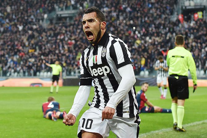 Juventus FC's Carlos Tevez celebrates after scoring the opening goal during the Serie A match against Genoa CFC at Juventus Arena on Sunday