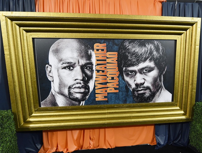 Promotional images of WBC/WBA welterweight champion Floyd Mayweather Jr. and WBO   welterweight champion Manny Pacquiao