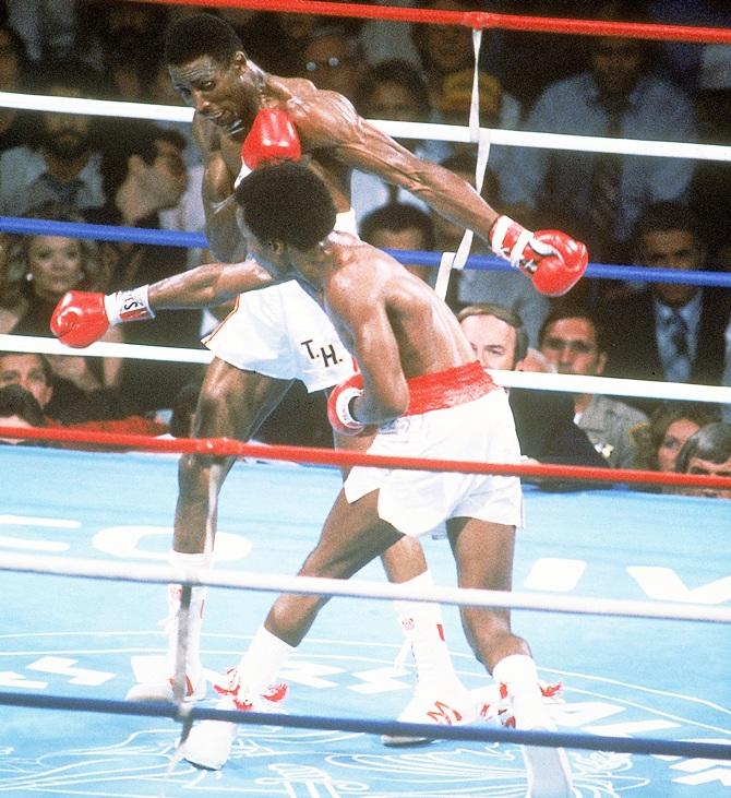 Sugar Ray Leonard throws a right punch at Thomas Hearns