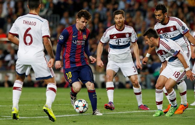 Barcelona's Lionel Messi tries to get past Bayern Munich's Thiago, Xabi Alonso, Juan Bernat and Mehdi Benatia in the Champions League semi-final first leg