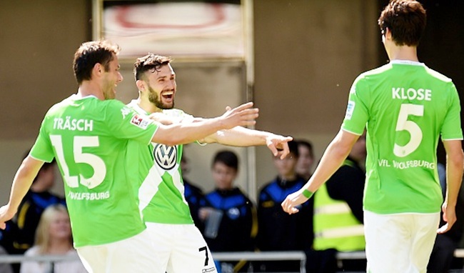 Wolfsburg's Christian Traesch and Daniel Caligiuri celebrate