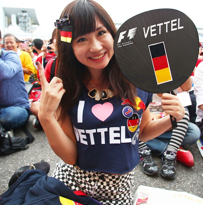 A fan of Sebastian Vettel of Germany and Ferrari attends Qualifying