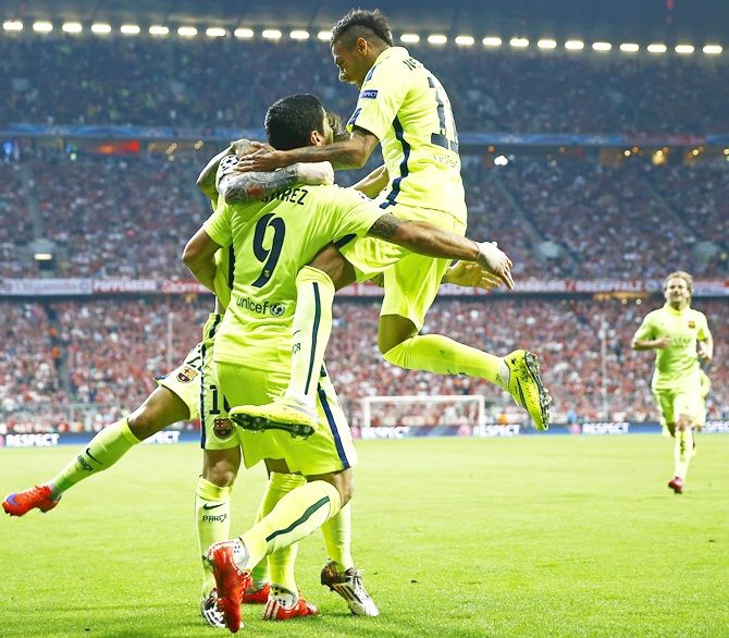Neymar celebrates with Luis Suarez