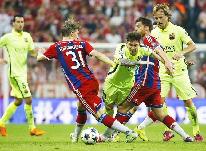 Barcelona's Lionel Messi and Ivan Rakitic in action 
