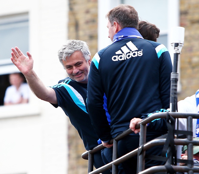 Chelsea manager Jose Mourinho waves to the Chelsea fans