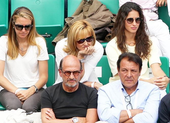 From left, Rafael Nadal's sister, mother Ana Maria Parera and girlfriend Xisca Perello